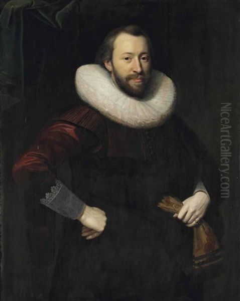 Portrait Of A Gentleman, Three-quarter-length, In A Red And Black Costume With A Lace Collar, Holding A Pair Of Gloves In His Left Hand Oil Painting by Cornelis van der Voort
