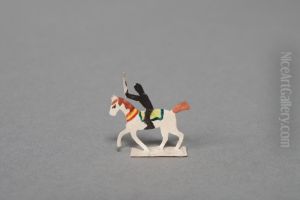 Black figure riding on a white horse [one of 36 figures]