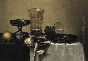 Still life with a silver tazza, a beer glass and an upturned berkemeyer
