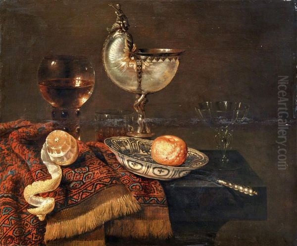 A clementine in a porcelain bowl, a nautilus cup, a roemer, two glasses, a knife, a peeled lemon on an ornamental carpet on a table Oil Painting by Willem Claesz. Heda