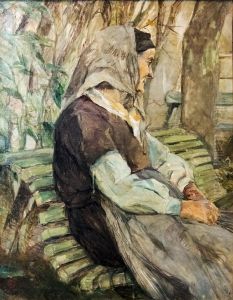 Old woman sitting on a bench in Celeyran
