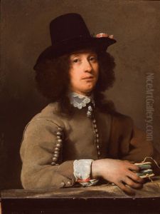 Portrait of a young man with a hat holding a book