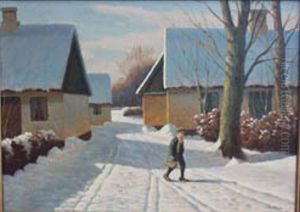 A boy walks in the snow among yellow houses.