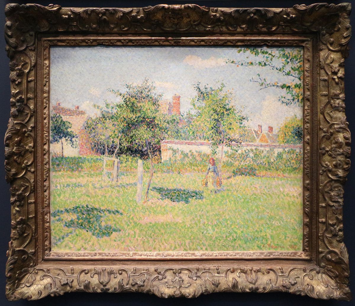 Femme dans un clos, soleil de printemps dans le pre a Eragny Oil Painting by Camille Pissarro