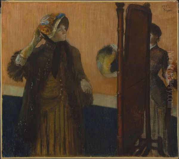 At the Milliner's Oil Painting by Edgar Degas