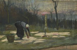 Woman spreading out laundry on a field