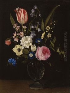 Still life with a rose, a tulip, a cornflower, morning glory, primuli and other flowers in a glass vase on a ledge. Still life with a rose, a tulip, a cornflower, morning glory, primuli and other flowers in a glass vase on a ledge.