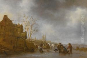 Winter landscape with figures on a frozen canal near a town