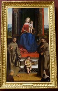 Madonna and Child enthroned with Saints Francis, Anthony and two donors