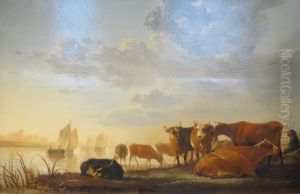 A shepherd with a herd of cows on the bank of a river