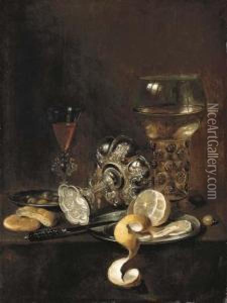 A Giant Roemer, An Upturned 
Goblet, A Glass, Bread, A Knife And A Partly-peeled Lemon On A Platter, 
On A Table Oil Painting - Pieter Claesz.