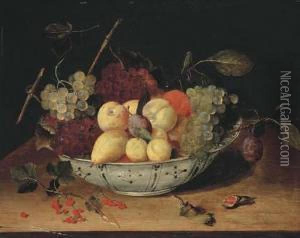 Raisins Et Prunes Dans Un Plat En Delft Sur Un Entablement Enbois Oil Painting - Jacob van Hulsdonck