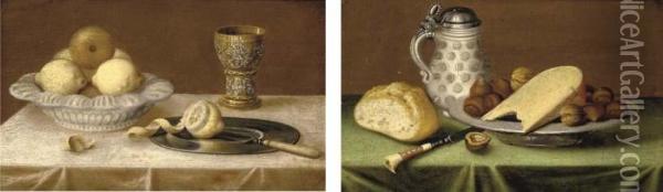 Lemons In An Earthenware Dish, A
 Silver Gilt Goblet, A Pewter Plate On A Draped Table; And An 
Earthenware Tankard, A Bread Roll, A Pewter Dish Of Hazlenuts And Cheese
 On A Draped Table Oil Painting - Jacob Fopsen van Es