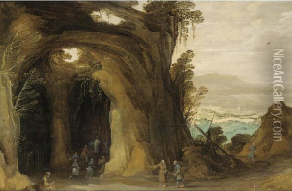 A Landscape With Pilgrims 
Attending A Service In A Grotto, A Monk Reading In The Foreground Oil Painting - Joos De Momper