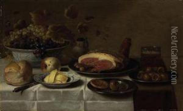 White And Blue Grapes In A 'kraak' Porcelain Bowl, A Loaf Of Bread,a Knife, Butter On A Porcelain Plate, A Biscuit And Medlar On Asilver Plate, A Mug Of Beer, A Joint Of Ham On A Third Silverplate, Oil Painting - Floris Gerritsz. van Schooten