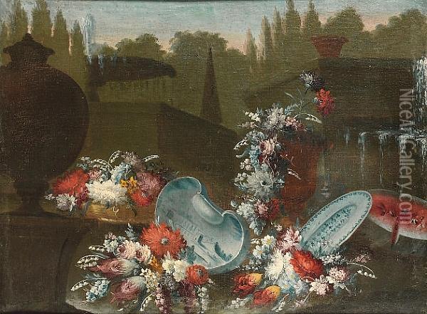 Mixed Flowers With Blue And 
White Bowls And Dishes And A Watermelon Before A Fountain And Urns In A 
Garden Oil Painting - Giuseppe Lavagna