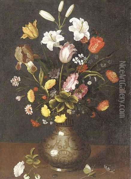 Lilies, tulips, an iris and other flowers in a porcelain vase on a ledge Oil Painting - Spanish School