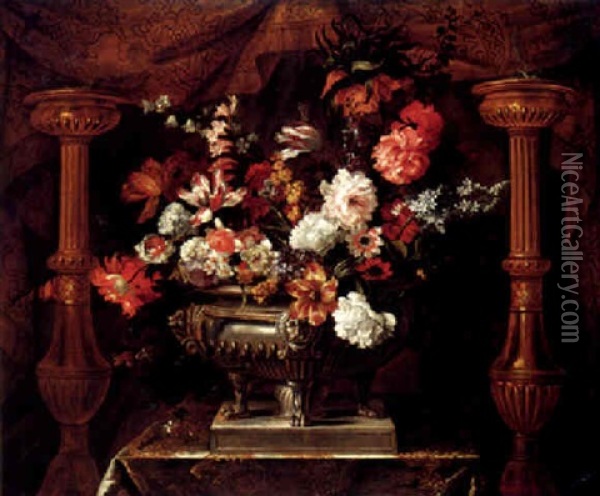 A Still Life Of Various Flowers In A Silver Gilt Urn, Flanked By Two Torcheres, An Embroidered Curtain Draped Behind Oil Painting - Jean-Baptiste Monnoyer