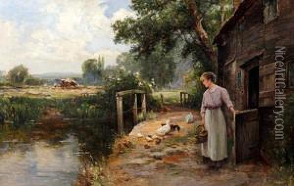 A Young Woman With Ducks By A Barn With Harvesting Beyond Oil Painting - Ernst Walbourn