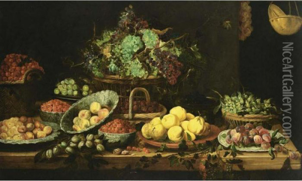 An Extensive Still Life Of 
Peaches, Apricots And Strawberries In Wan-li Porcelain Bowls, 
Quince-pears On A Stone Plate, Black Prunes On A Chinese Plate, 
Hazelnuts, Grapes, Blackberries And Cherries In Baskets, Berries And 
White Prunes In Copper Bo Oil Painting - Frans Snyders