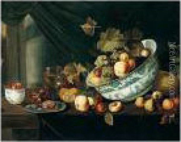Still Life With Fruit Tumbling From A Porcelain Bowl, On A Wooden Table Oil Painting - Michiel Simons