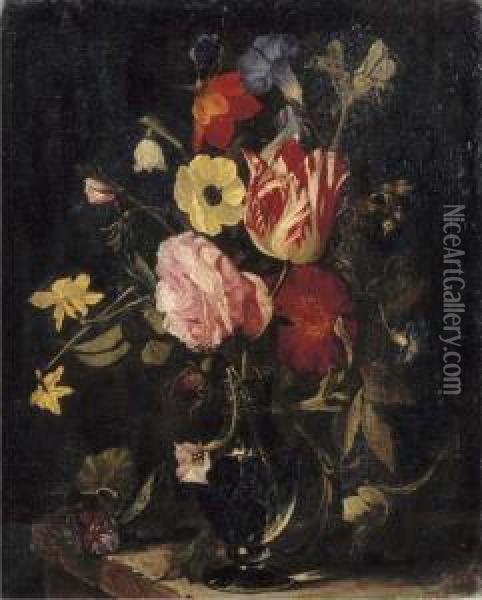 Roses, Tulips, An Iris, Pansies And An Anemone In A Glass Vase On Astone Ledge Oil Painting - Daniel Seghers