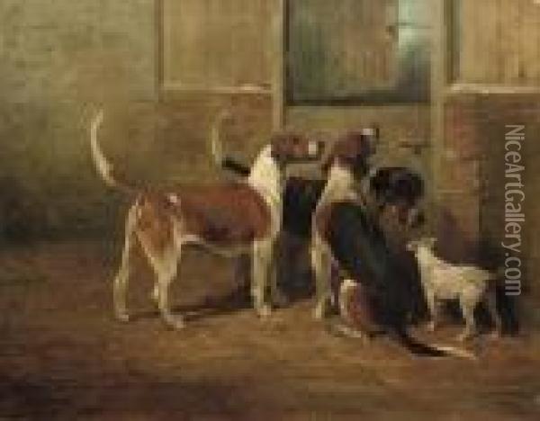 Foxhounds And A Lakeland Terrier By A Stable Door Oil Painting - John Emms