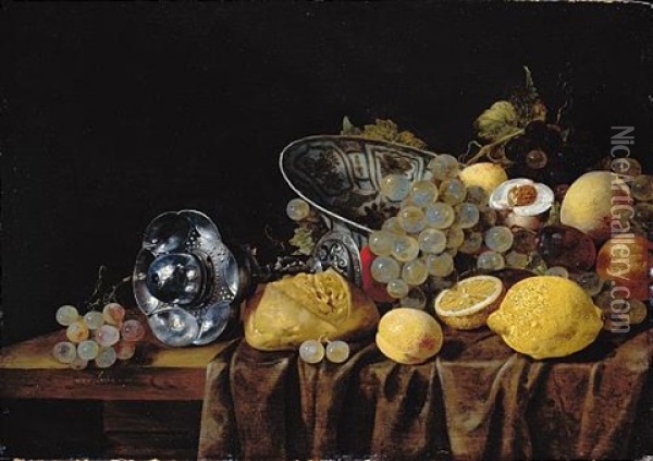 A Still Life Of Lemons, Grapes And Peaches, With A Bread Roll And A Silver Pokal On A Partly Draped Table Oil Painting - Christiaan Luycks