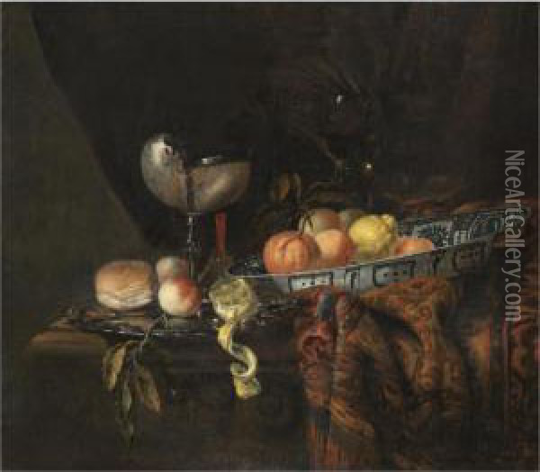 A Still Life With Oranges, 
Peaches And A Lemon In A Blue-and-white China Bowl, A Silver-gilt 
Nautilus Cup On A Silver Gilt Plate Together With A Lemon, A Bread Roll 
And A Knife, Together With A Roemer And A Wine Glass, All On A 
Partly-draped Table Oil Painting - Juriaen van Streeck