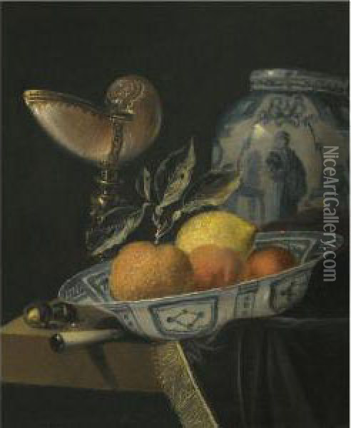 A Still Life Of An Orange, A Lemon And Two Peaches In A Wan-liporcelain Bowl On A Table With A Fringed Carpet And A Nautiluscup Oil Painting - Juriaen van Streeck