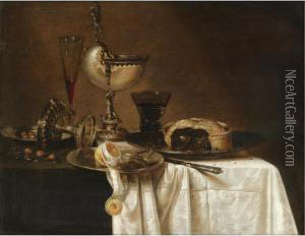 Still Life With An Overturned 
Tazza, A Tall Wine Glass, An Open Pie On A Pewter Plate, A Partly Peeled
 Lemon And A Nautilus Cup All Arranged On A Partly Draped Table Oil Painting - Willem Claesz. Heda