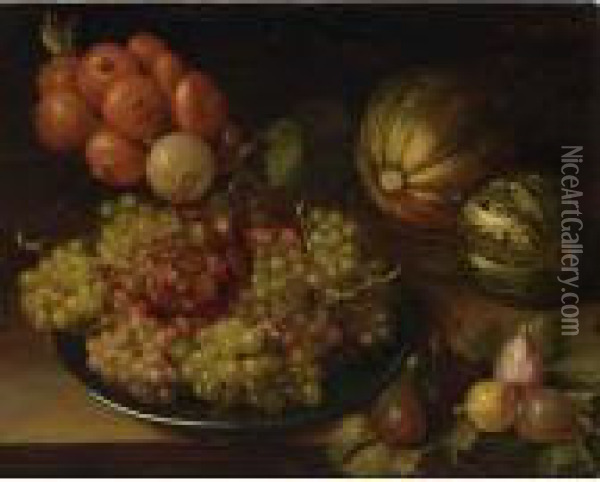A Still Life With Black And 
White Grapes On A Silver Platter, Together With Figs, Melons And Unions,
 All On A Table Oil Painting - Isaak Soreau