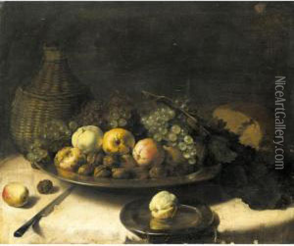 A Still Life With Fruit And 
Walnuts In A Silver Bowl, A Cask Of Wine, A Knife And Other Objects Laid
 Out On A Draped Table Oil Painting - Pieter Van Boucle