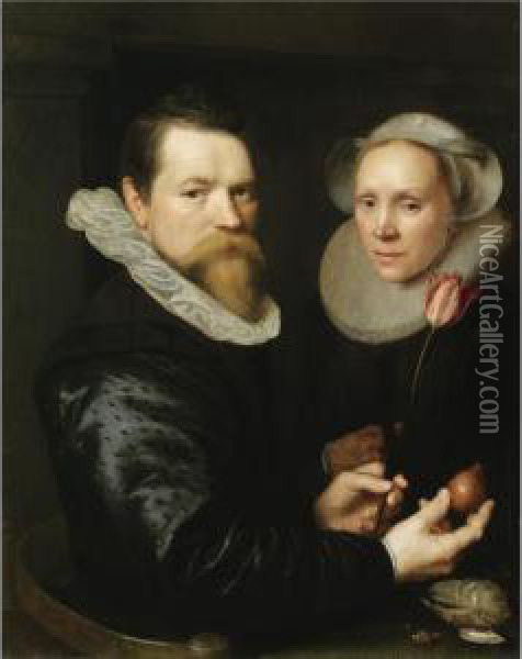 A Double Portrait Of A Husband 
And Wife, Both Half-length, He Holding A Tulip And A Bulb, A Selection 
Of Shells On The Shelf Below Oil Painting - Michiel Jansz. Van Miereveldt