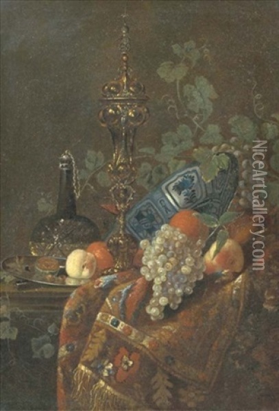 Oranges In A Wanli Kraak Porselein Bowl, A Peach And Nuts On A Silver Plate, A Glass Vessel Of Wine, A Gilt Cup And Cover And White And Black Grapes, All On A Partially Draped Table Oil Painting - Barend van der Meer