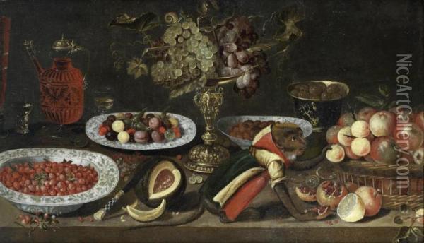 Grapes In A 
Tazza 
, A Glass And Carafe Of Red Wine, A Bowl Of Strawberries, A Split Melon,
 A Clothed Monkey, A Bowl Of Olives And A Basket Of Apples On A Wooden 
Table Oil Painting - Artus Claessens
