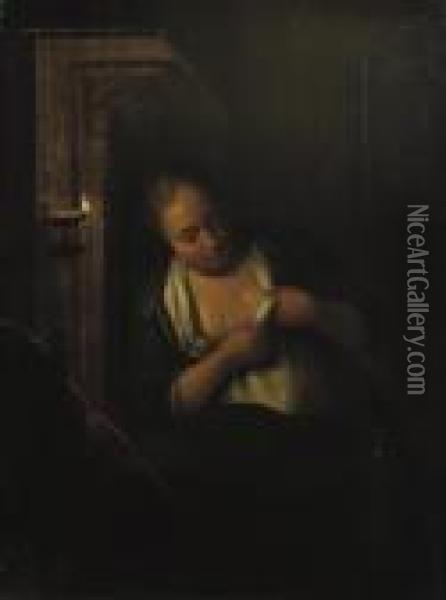 A Young Woman De-fleeing Herself In A Candlelit Interior Oil Painting - Michiel van Musscher
