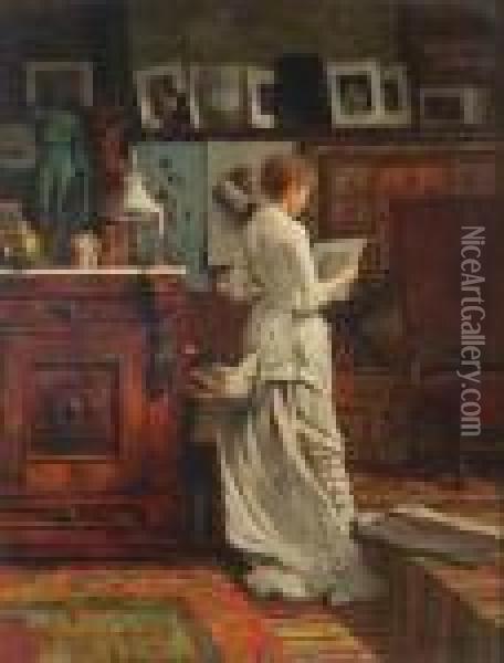 American, - Elegantwoman Looking At A Print Oil Painting - Louis Charles Moeller