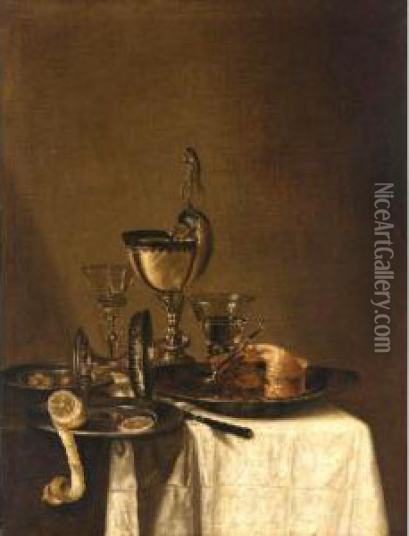 Still Life Of A Nautilus Cup, An
 Overturned Tazza, A Partially Eaten Pie In A Pewter Bowl And A Knife, 
Together With Two Wine Glasses, And Olives And A Peeled Lemon In Pewter 
Dishes, All Arranged Upon A Table Top Partly Draped With A White Cloth Oil Painting - Willem Claesz. Heda