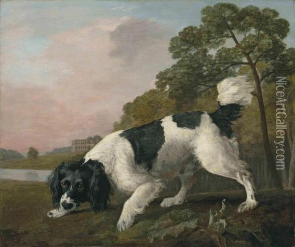 A Black And White Spaniel 
Following A Scent, In A Landscape With Alake And A Country House Beyond Oil Painting - George Stubbs
