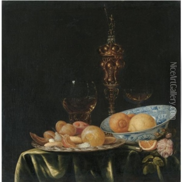 Still Life With Oranges And Lemons In A Blue And White Porcelain Dish, A Large Gold Pronckblokaal And A Silver Platter, All Arranged On A Draped Table Oil Painting - Simon Luttichuys