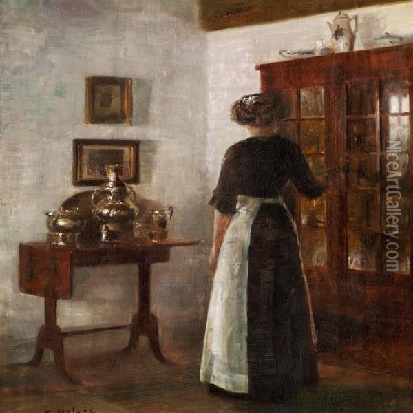 Interior With A Woman Stading Next To A Cabinet Oil Painting - Carl Vilhelm Holsoe