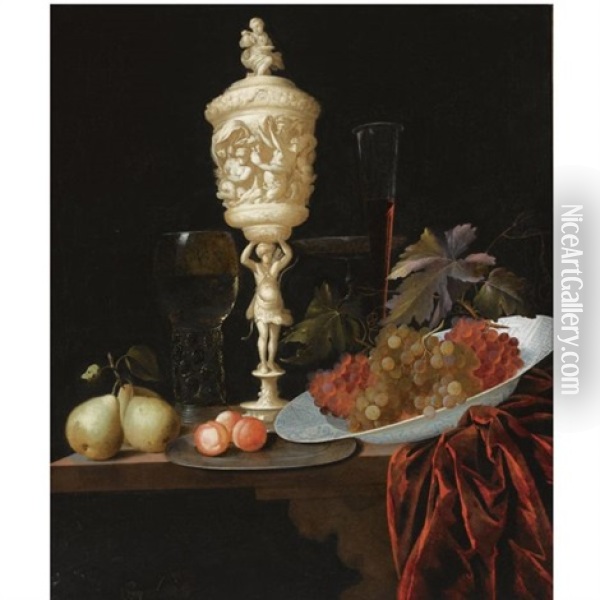A Still Life With An Ivory Carved Cup And Cover, A Roemer, Pears, Prunes On A Pewter Plate, Grapes In A Porcelain Wan-li Bowl, A Flute-glass And A Tazza, All On A Wooden Ledge Draped With A Red Velvet Oil Painting - Georg Hainz