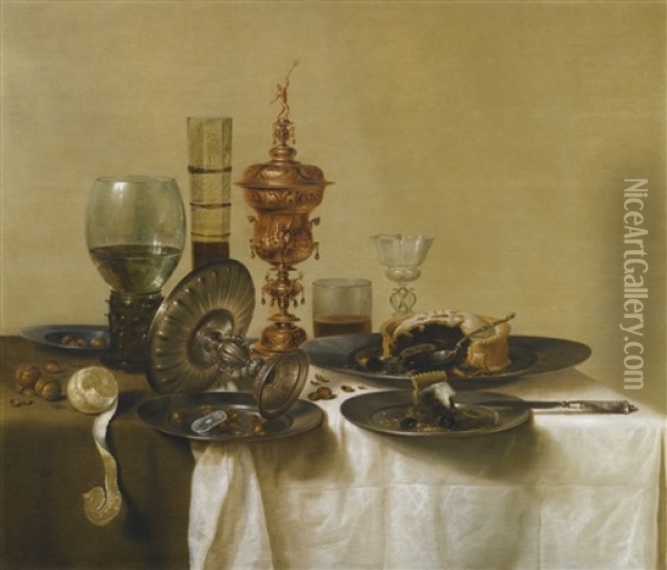 A Still Life With A Gilt Cup, A Silver Tazza, Glasses And Pewter Plates With A Pie, Peeled Lemon And Nuts, All Upon A Draped Table Oil Painting - Willem Claesz Heda