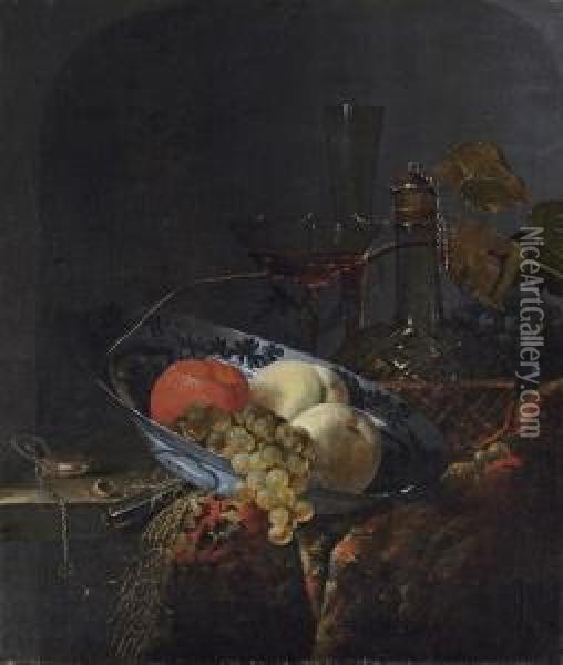 Grapes, Peaches And An Orange In
 A Porcelain Bowl, With A Watch,nuts, A Knife, A Glass Decanter, 
Wine-glasses, Grapes And A Carpeton A Wooden Table Oil Painting - Barend or Bernardus van der Meer