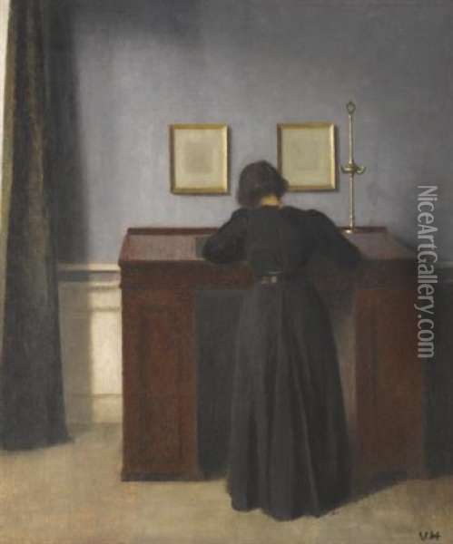 Ida Standing At A Desk Oil Painting - Vilhelm Hammershoi