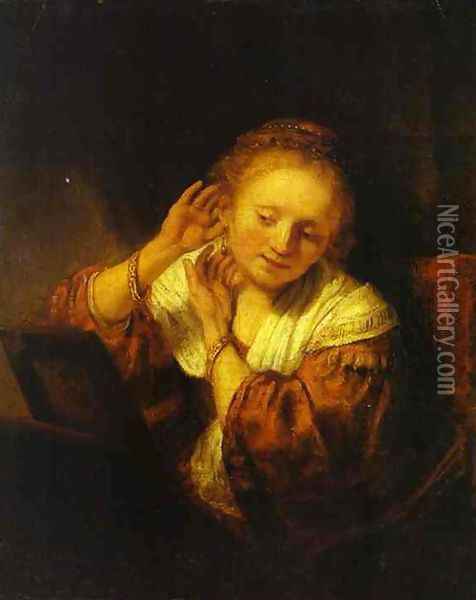 A Young Woman Trying on Earings Oil Painting - Rembrandt Van Rijn