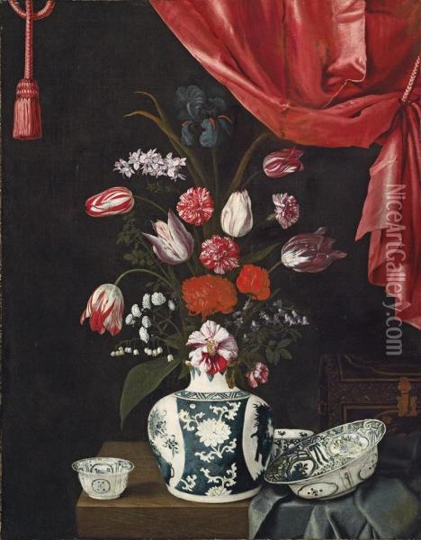 Tulips, Carnations And Other Flowers In A Chinese Porcelain Vase, With Other Chinese Vessels And A Lacquered Coffer On A Partly-draped Table, A Draped Curtain Above Oil Painting - Jean Picart