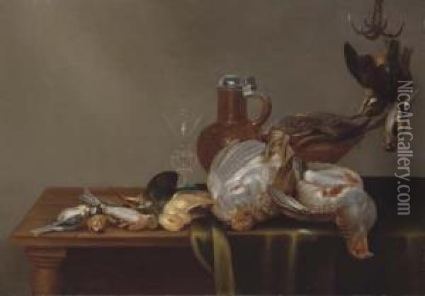 A Blue Tit, A Red Finch, A 
Patridge, A Kingfisher, And Other Dead Birds On A Half Draped Table, 
With A Glass And Silver Rimmed Jug Oil Painting - Alexander Adriaenssen