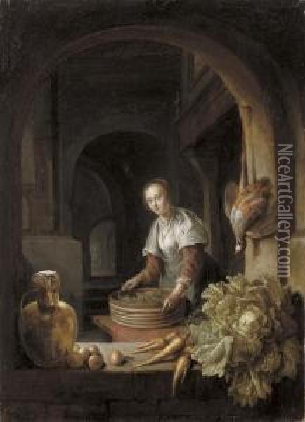A Maid Preparing Vegetables In A Kitchen Oil Painting - An Adriansz Van Staveren